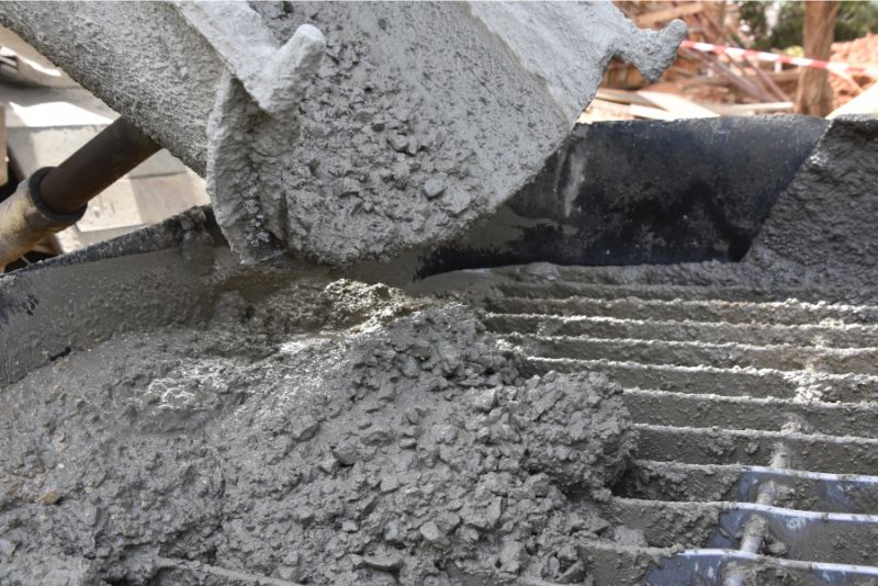 Concrete pouring process on a mesh for a slab