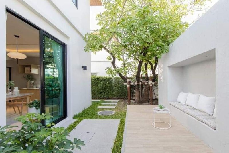 A photo of an open patio extended to a house